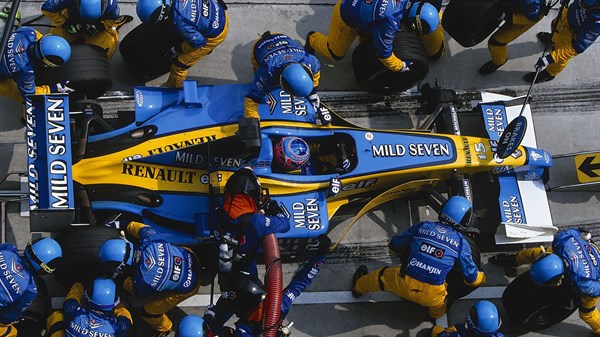 Renault Formula 1 team on the racetrack inspecting the car